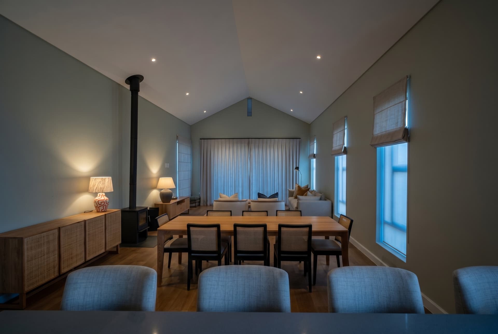 Constantia — the open-plan living and dining room at dusk