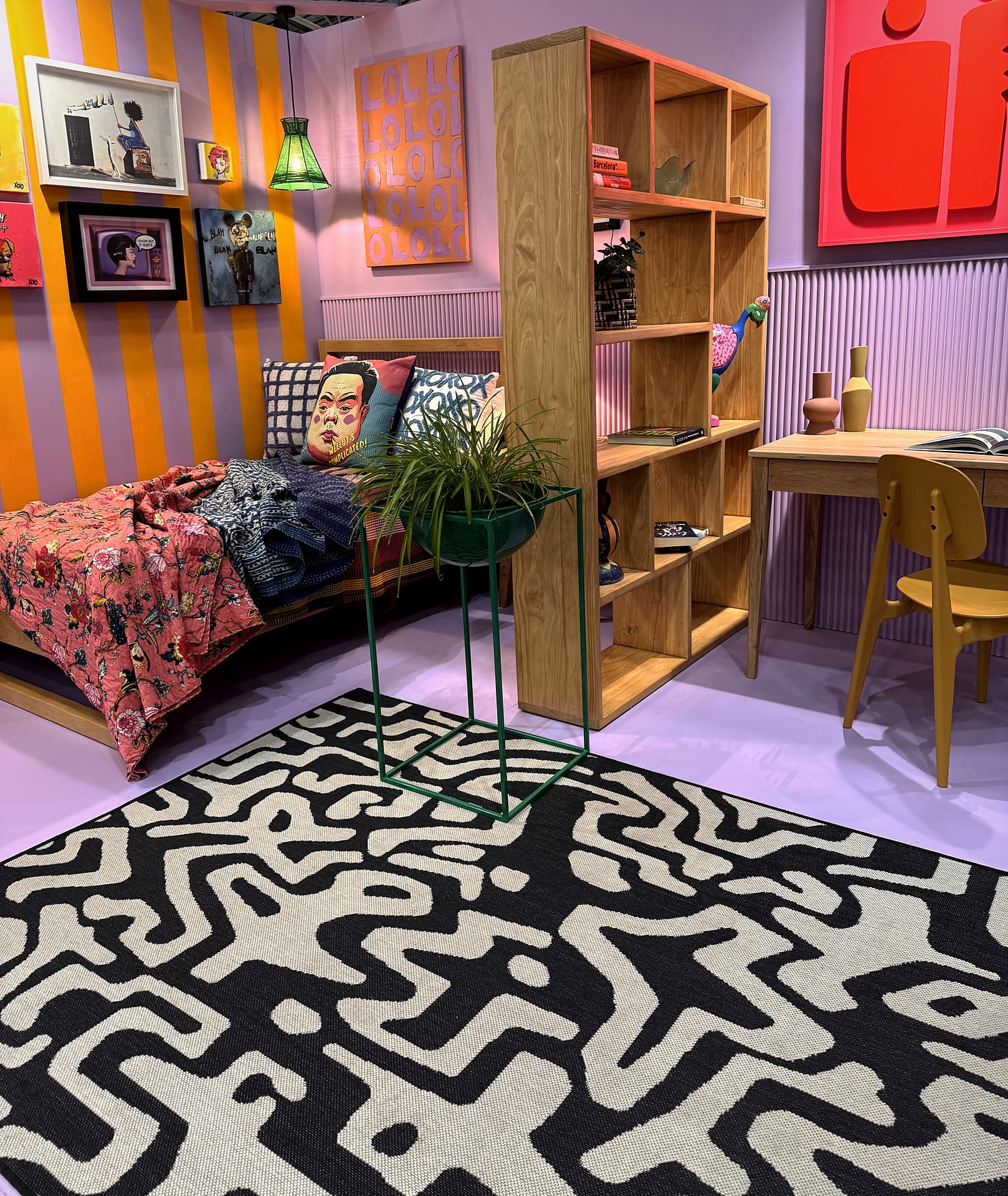 Urban Living Pod – Low angle across the rug to the bed and shelving